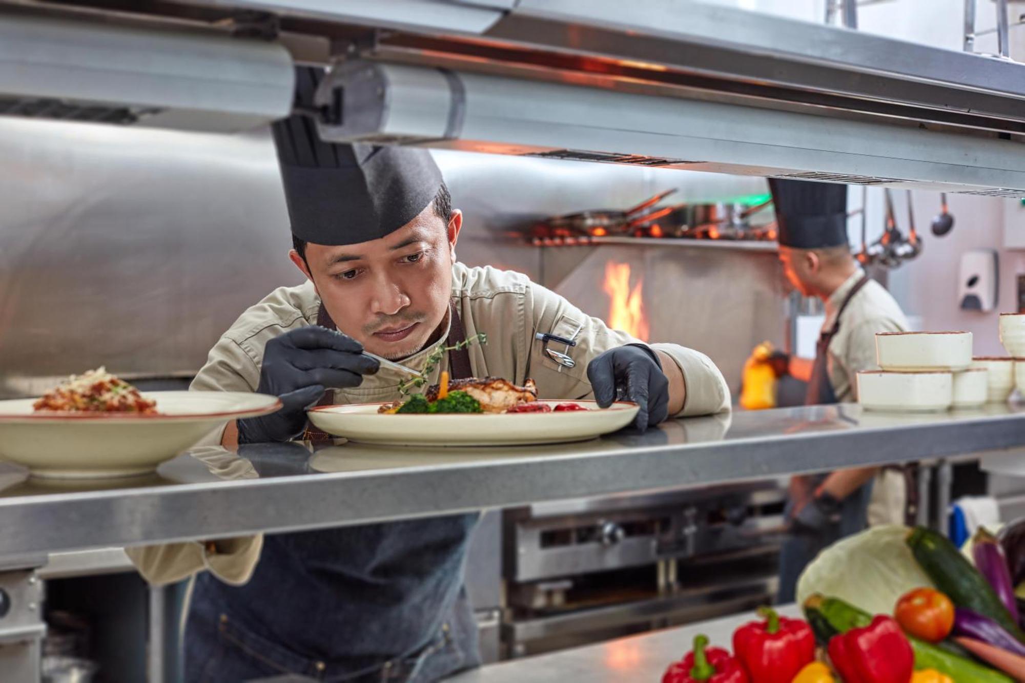 Mardhiyyah Hotel And Suites Shah Alam Exterior foto A chef finishing a dish